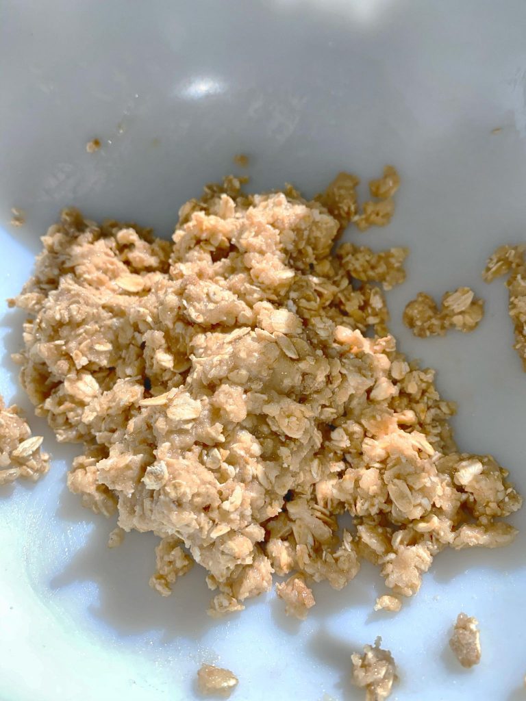 ball of mixed ingredients in the center of mixing bowl showing consistency of mixture for all natural  rat poison for recipe number one