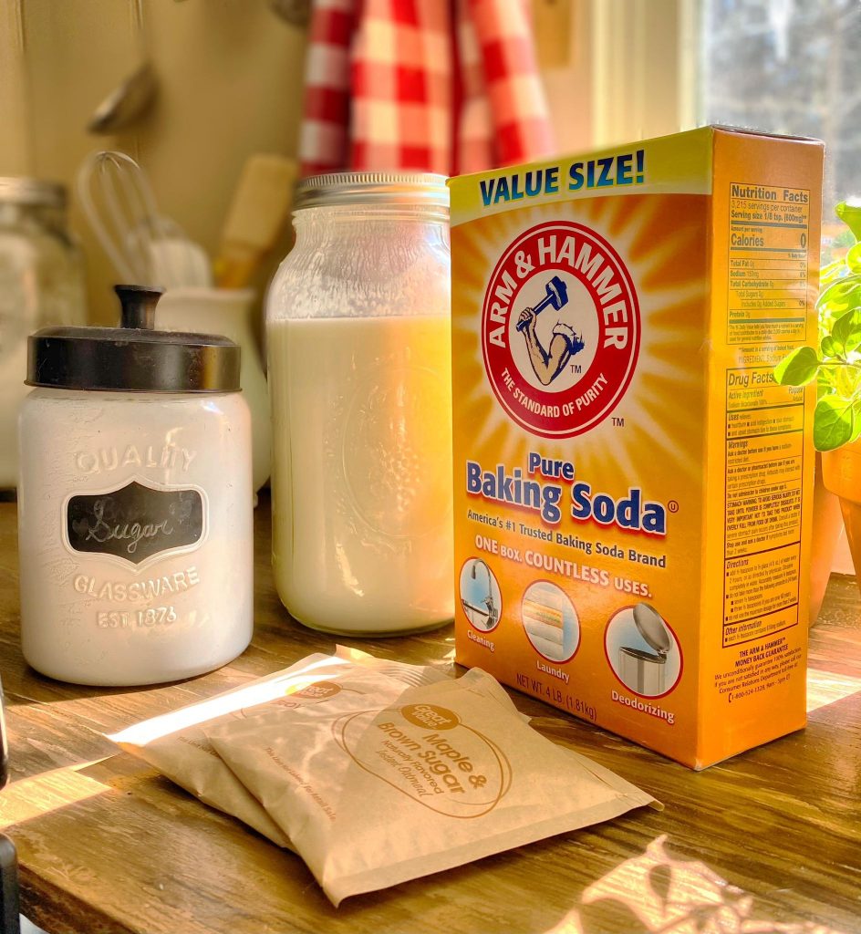 from left to right, sugar, half gallon mason jar of yogurt, box of baking soda and two bags of maple and brown sugar oatmeal